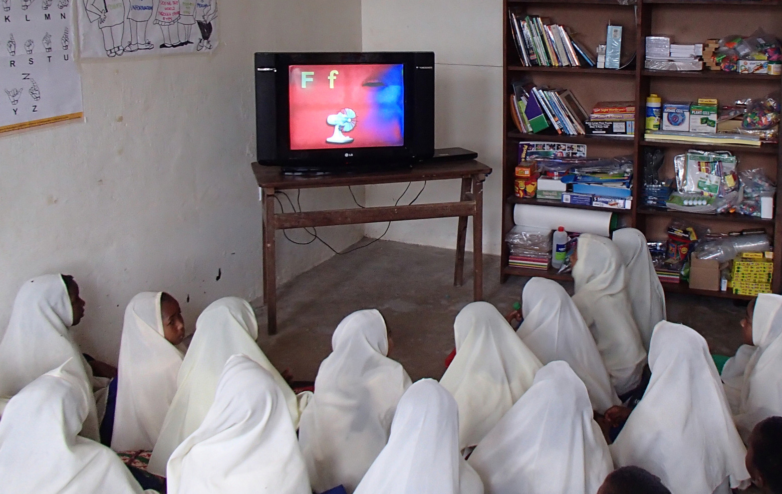 Children view one of many Opportunity Education's primary school videos.