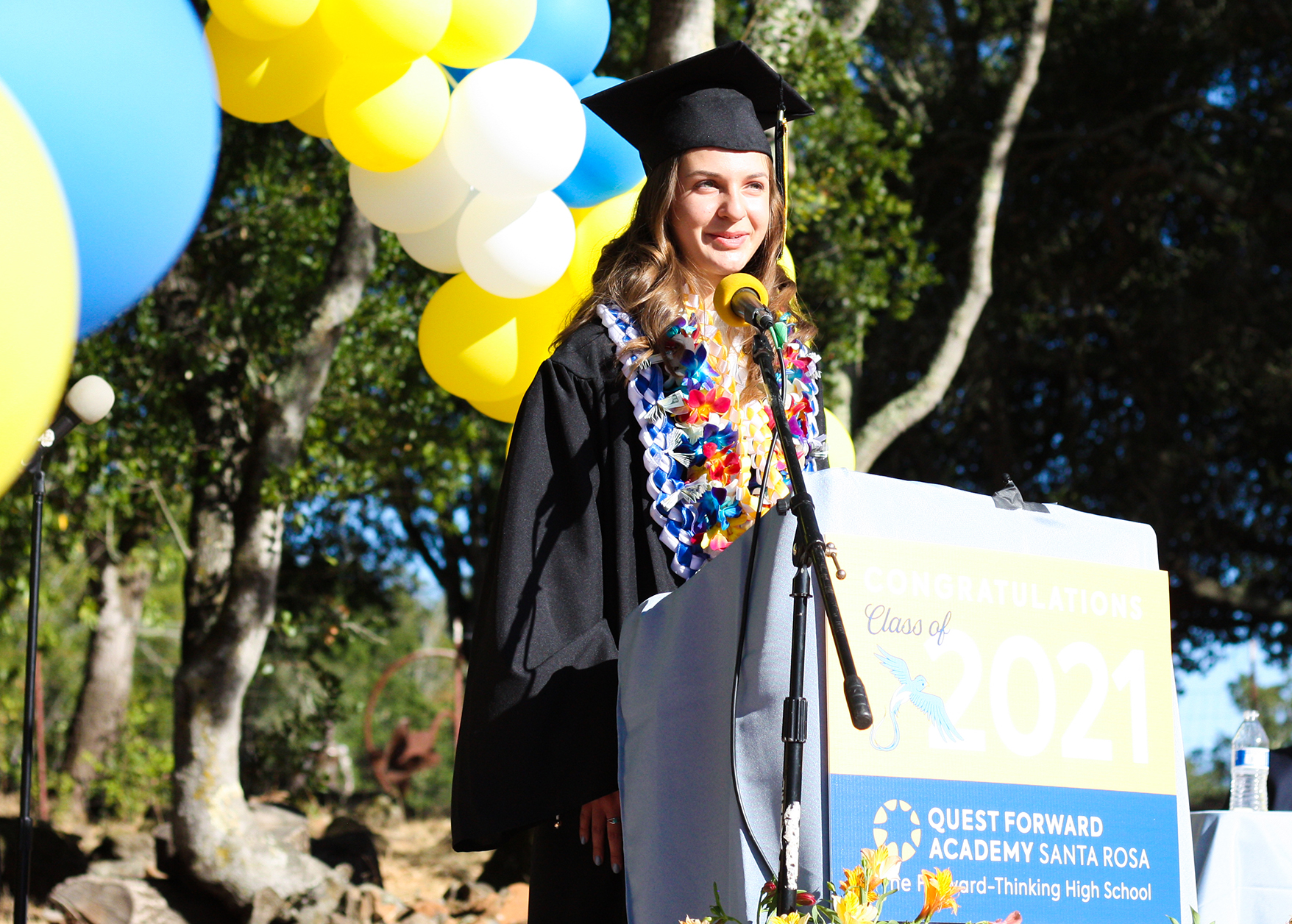 A graduate speaks at the 2021 commencement ceremony for Quest Forward Academy Santa Rosa